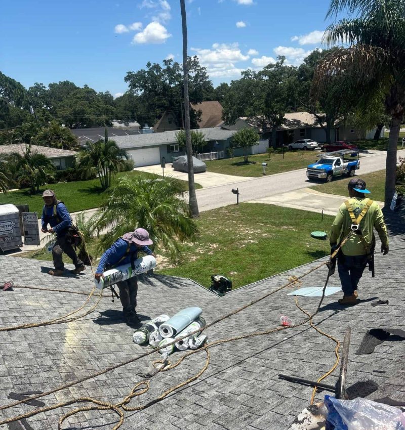 The Roofing Company of Tampa Bay crew working on Rooftop